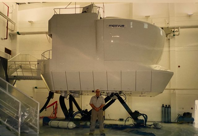 Standing in front of a MaxVue full-flight simulator